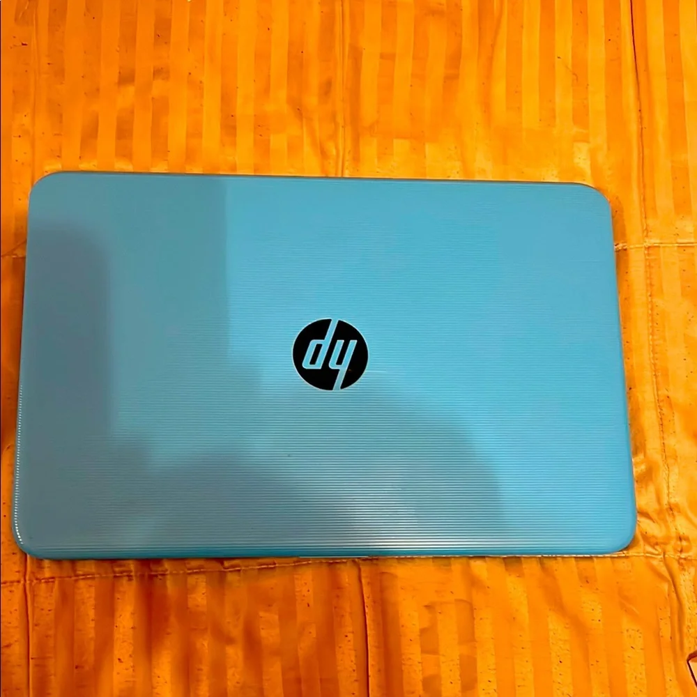 HP Blue Laptop with Matte Finish and Compact Design  BTW NEEDS NEW CABLE CHARGER